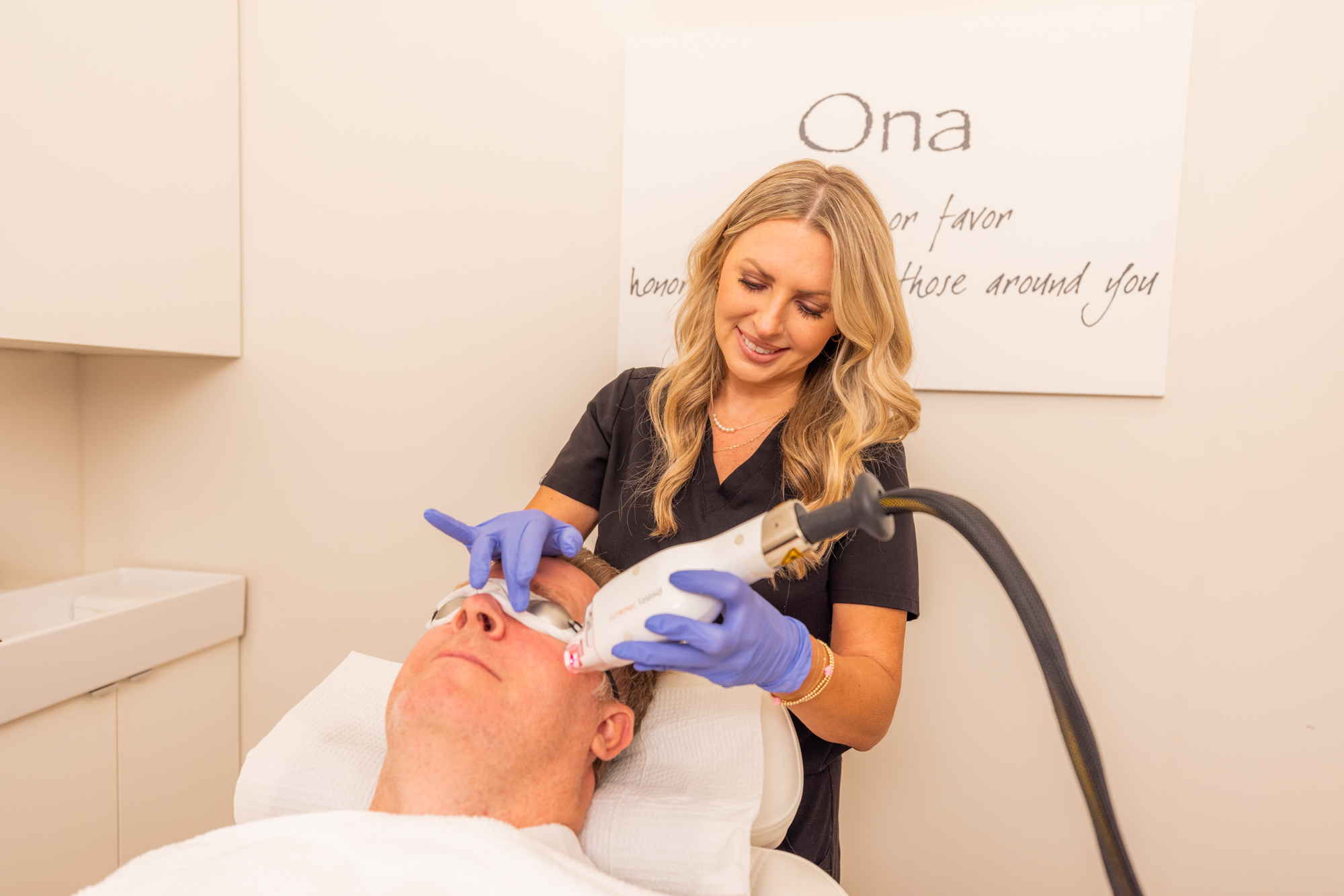 Ona Skincare staff member performing laser skin resurfacing as a part of a patient's regimen for skin care in East Nashville